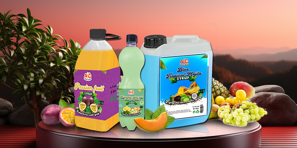 A selection of ANC syrups, featuring passion fruit, lime, and blue tropical flavors, set against a scenic sunset backdrop, emphasizing their refreshing and exotic taste.